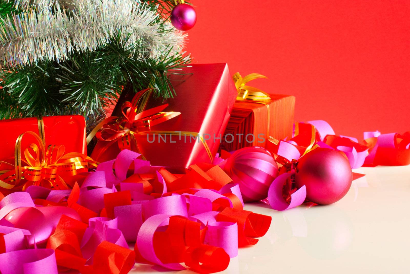 Christmas gifts over red background