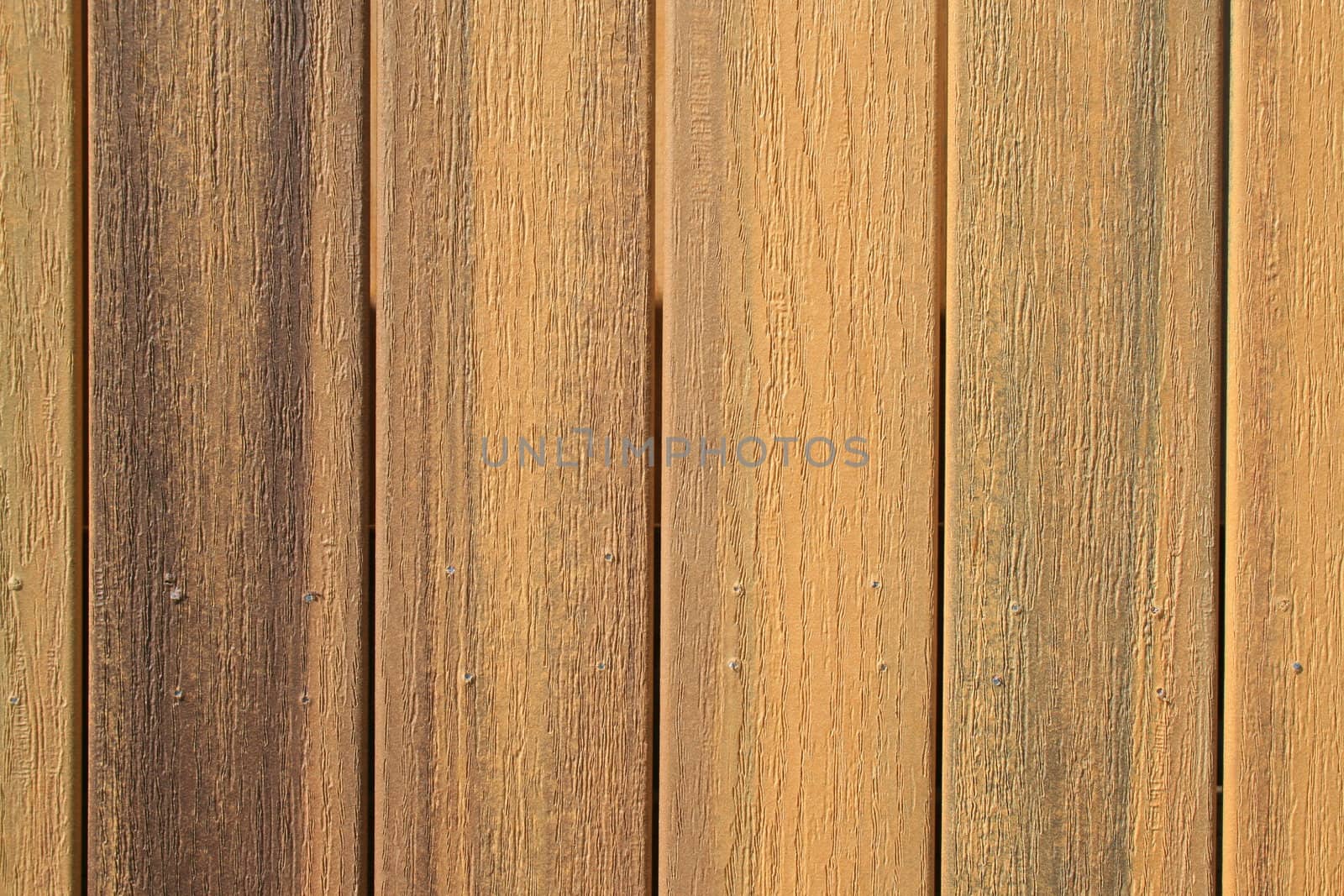 Close up of a wooden wall showing unique pattern.
