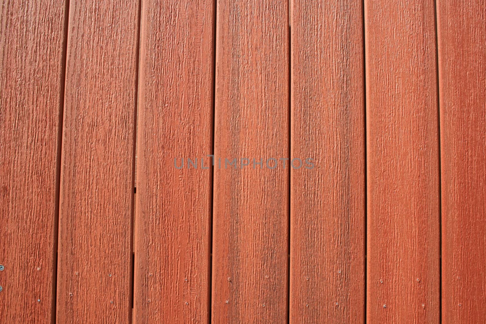 Close up of a wooden wall showing unique pattern.
