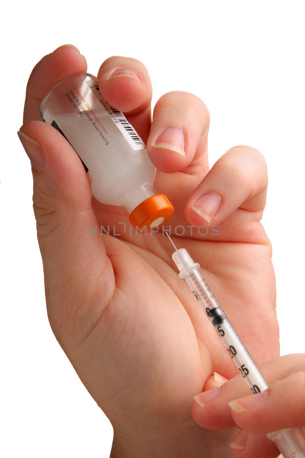 Close up of syringe with vial of medication isolated on white background