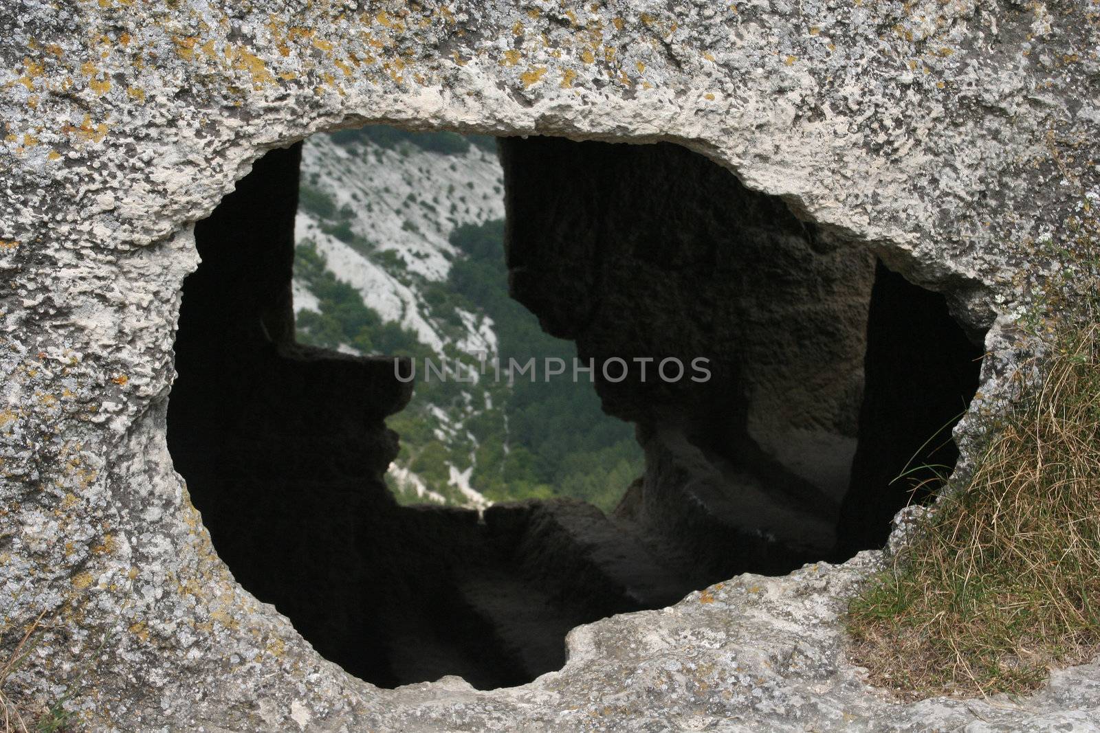 Sight through a stone wall on the next mountain 