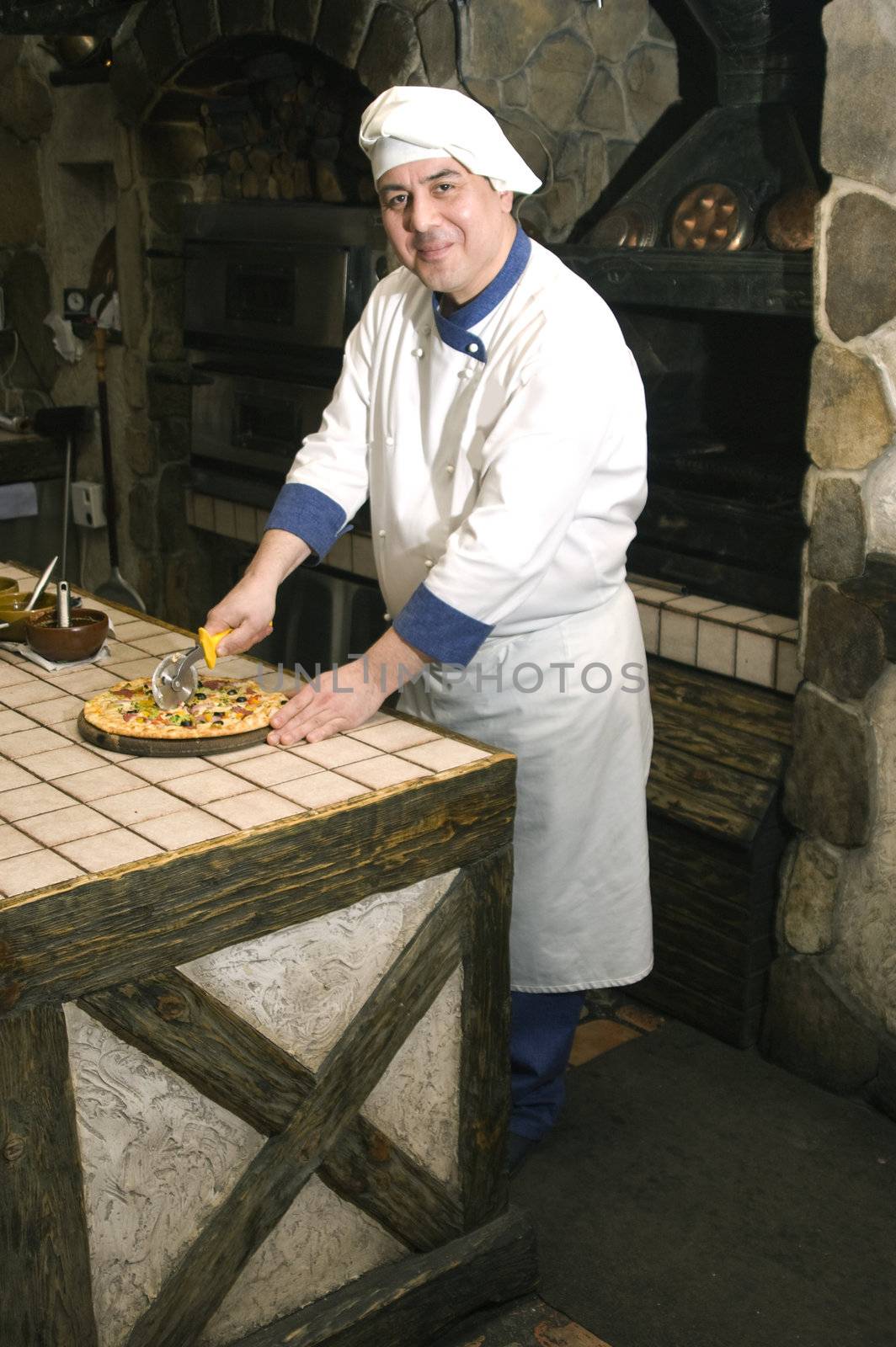 Cook cooking on the kitchen.