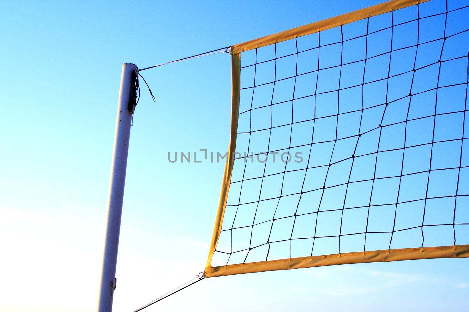 Foto of volleyball net at sunny summer day