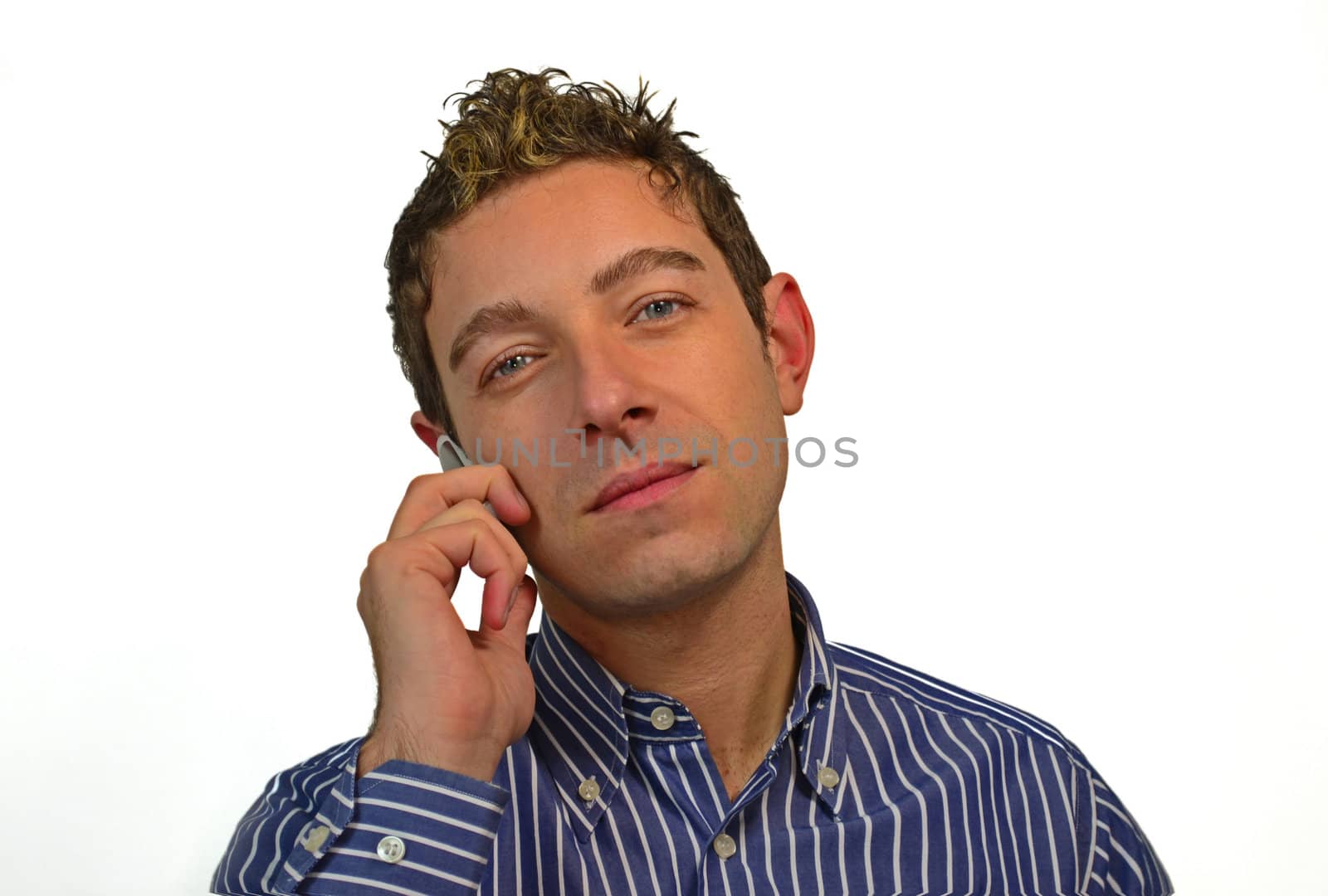 Attractive young man using his mobile phone, isolated on white