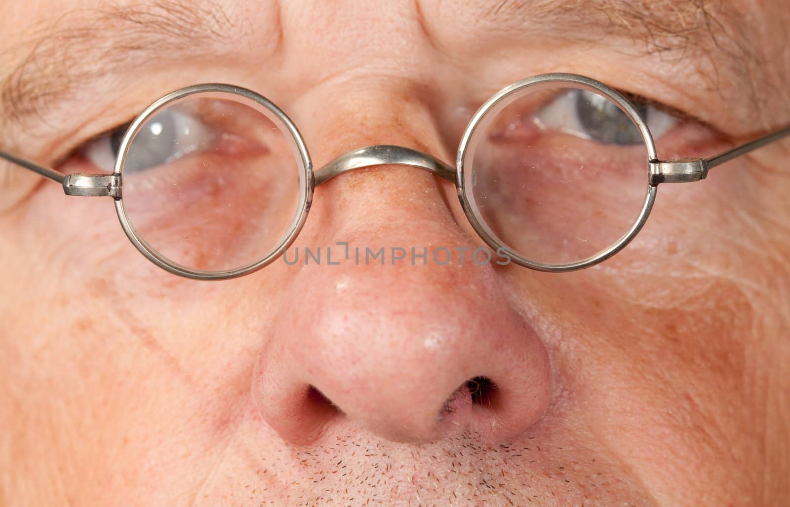 Senior man with focus on glasses by steheap