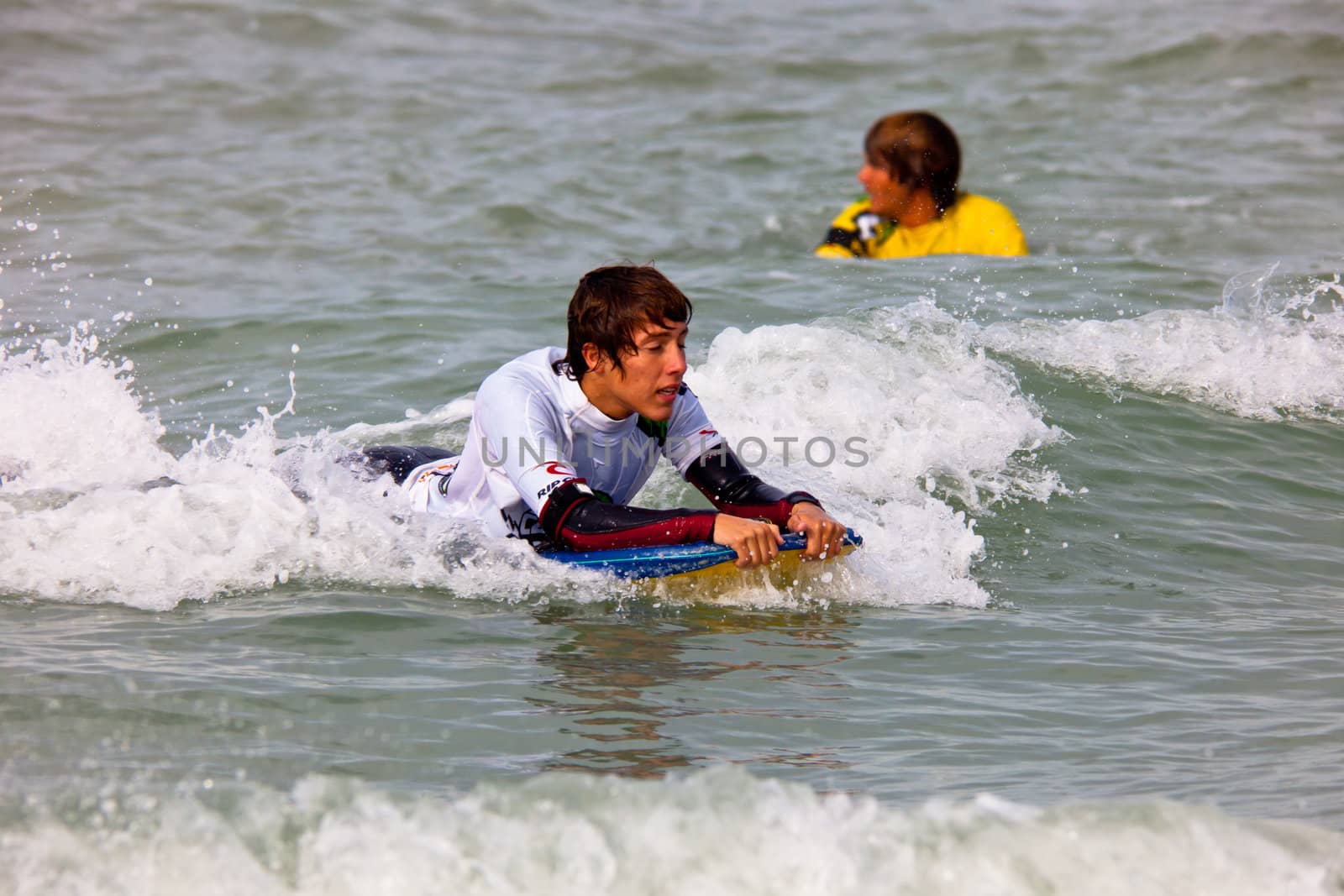 SAN FERNANDO, CADIZ, SPAIN - FEB 19: Unknown bodyboader taking waves on the 2nd championship of Surf and BodyBoard Impoxibol on Feb 19,2011 on the beach of Camposoto of San Fernando, Cadiz, Spain