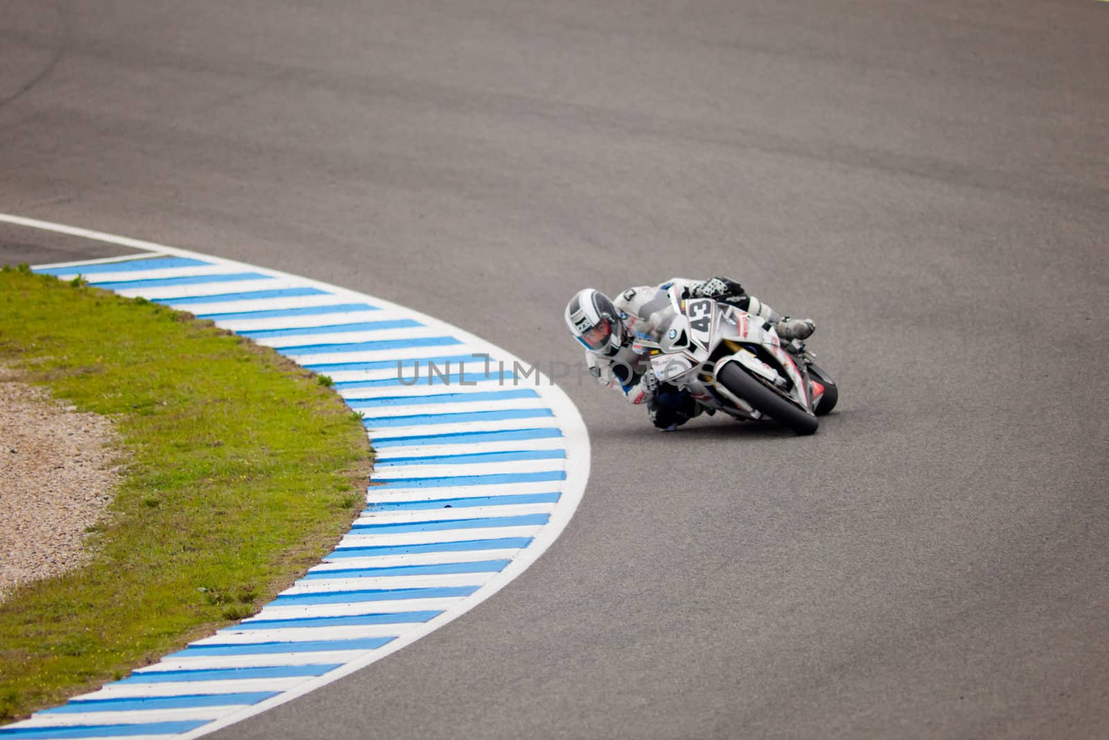 JEREZ DE LA FRONTERA, SPAIN - NOV 20: Stock Extreme motorcyclist Enrique Rocamora takes a curve in the CEV championship on Nov 20, 2010, in Jerez de la Frontera, Spain