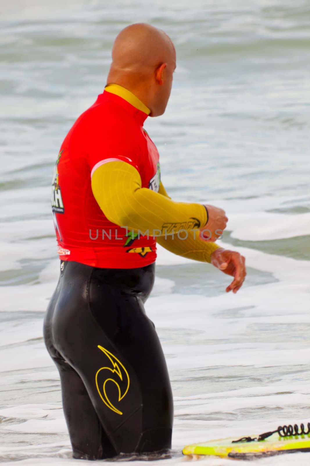 SAN FERNANDO, CADIZ, SPAIN - FEB 19: Unknown bodyboader going to the water on the 2nd championship of Surf and BodyBoard Impoxibol on Feb 19,2011 on the beach of Camposoto of San Fernando, Cadiz, Spain