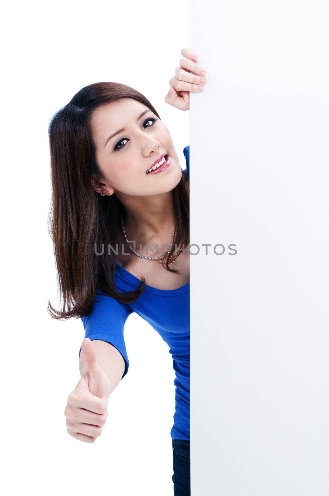 Portrait of a cute woman holding a blank billboard, isolated on white background.