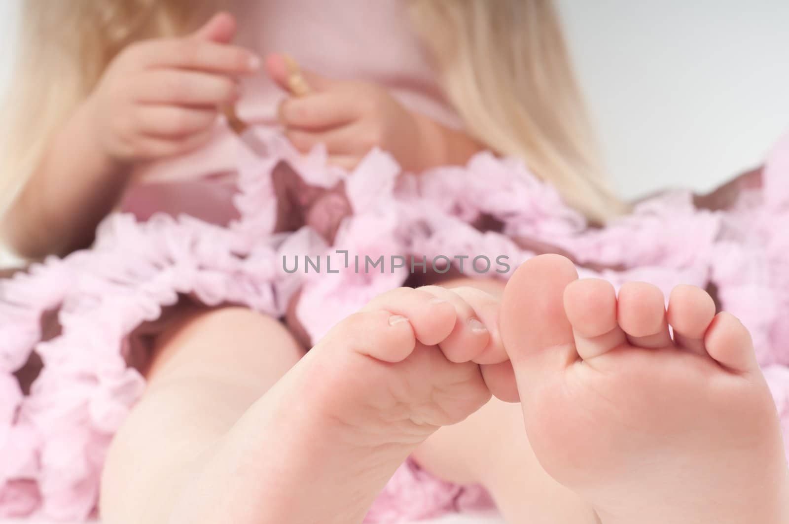 Toes of little girl in studio by anytka