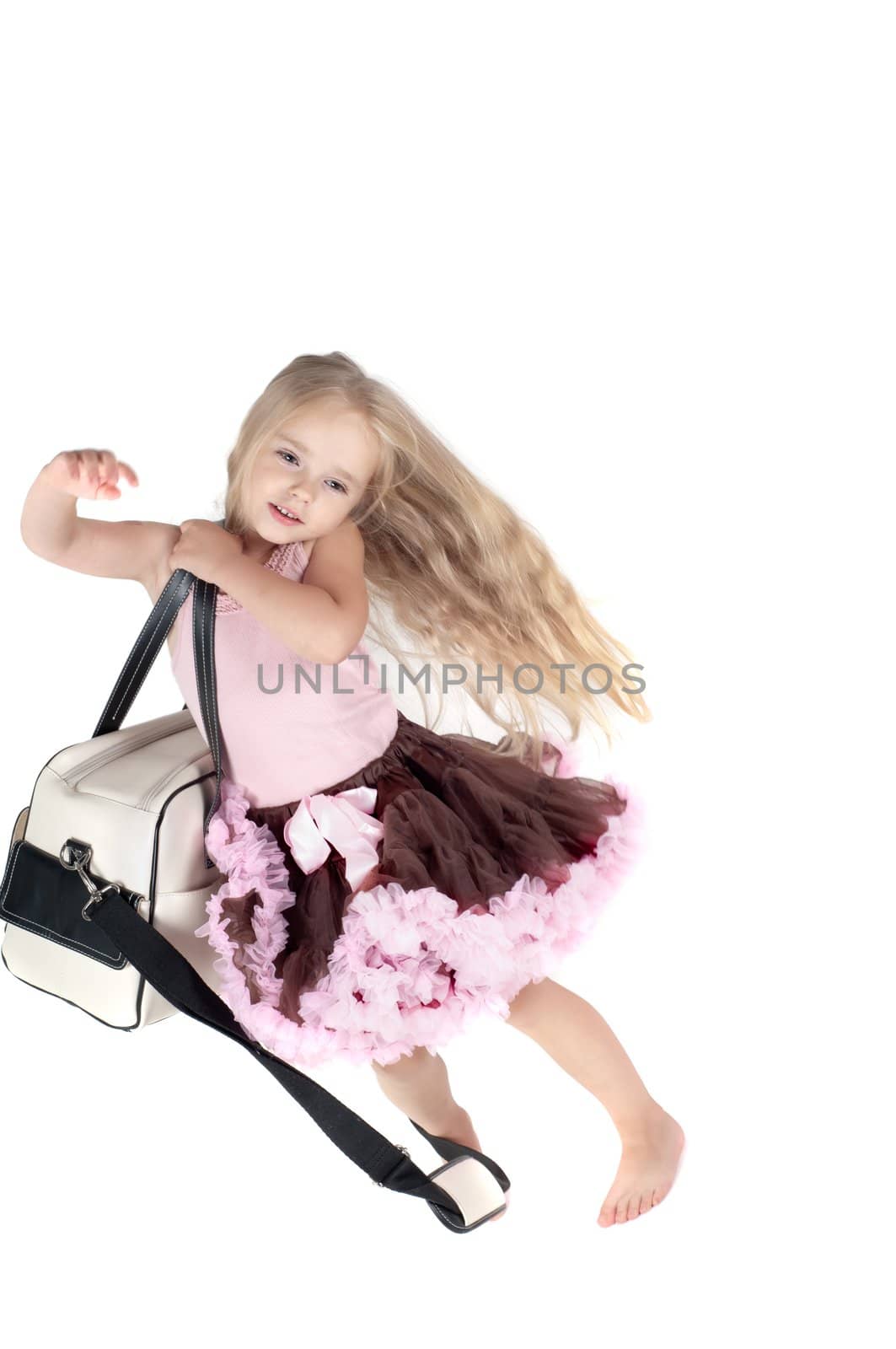 Shot of little girl with long blond hair in studio