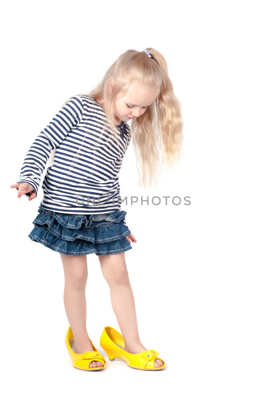 Shot of little cute with mother shoes in studio