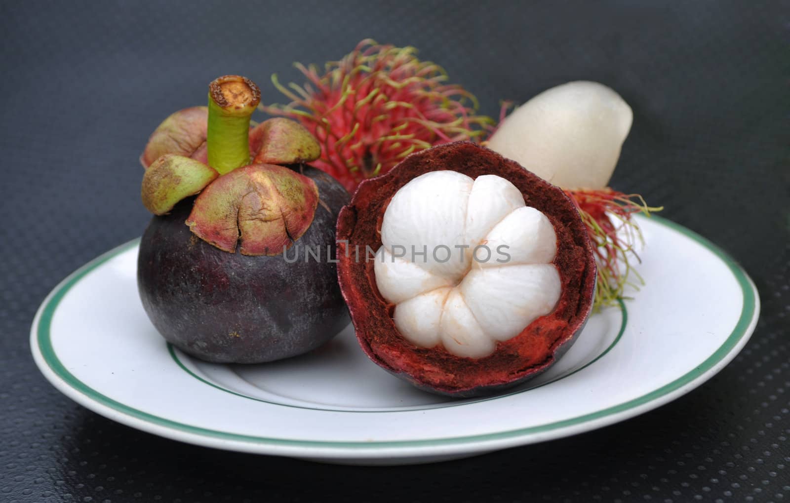 Tropical fruit rambutan and mangosteen on plate