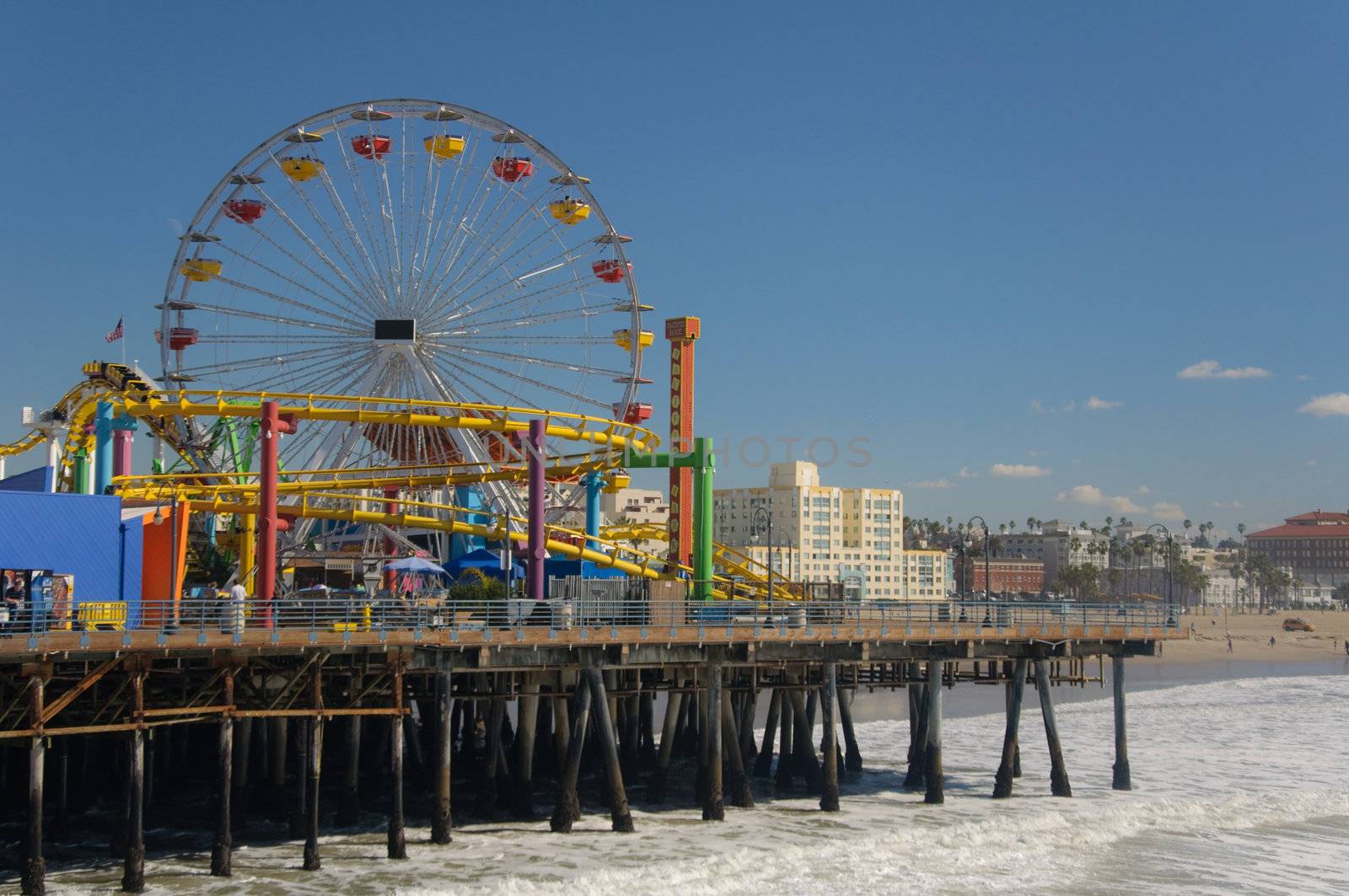 Ferris wheel on the Santa Monica Pier on a bright sunny summer day.