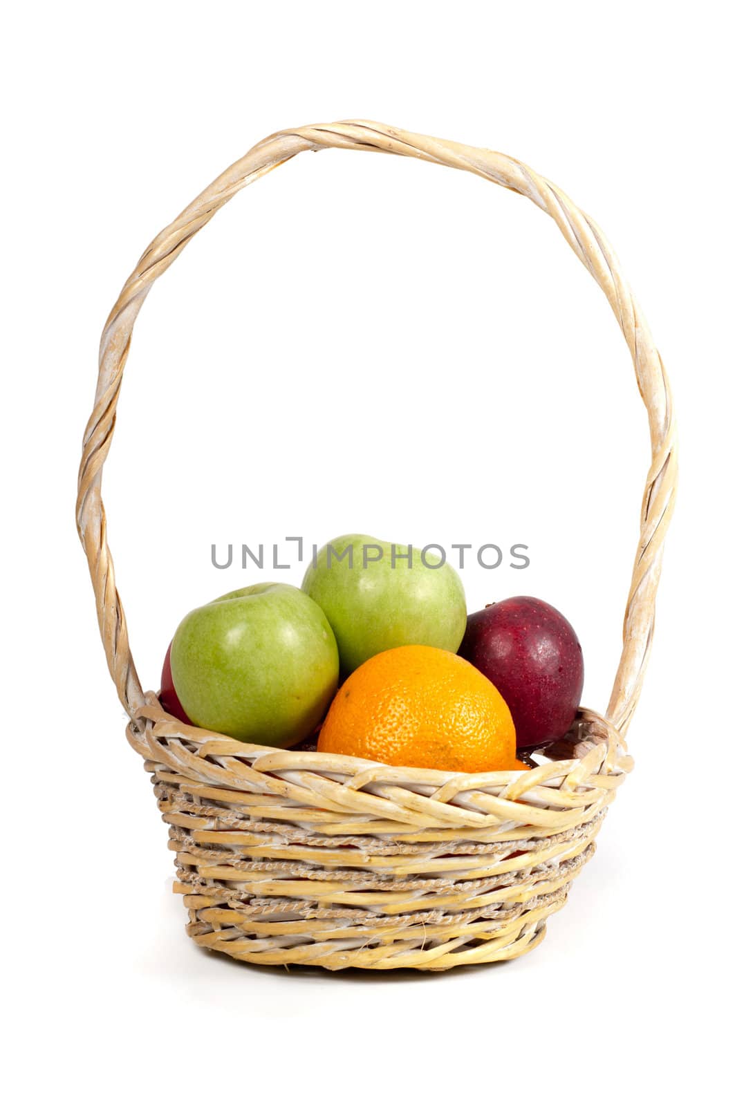 Basket with fresh fruits isolated on white
