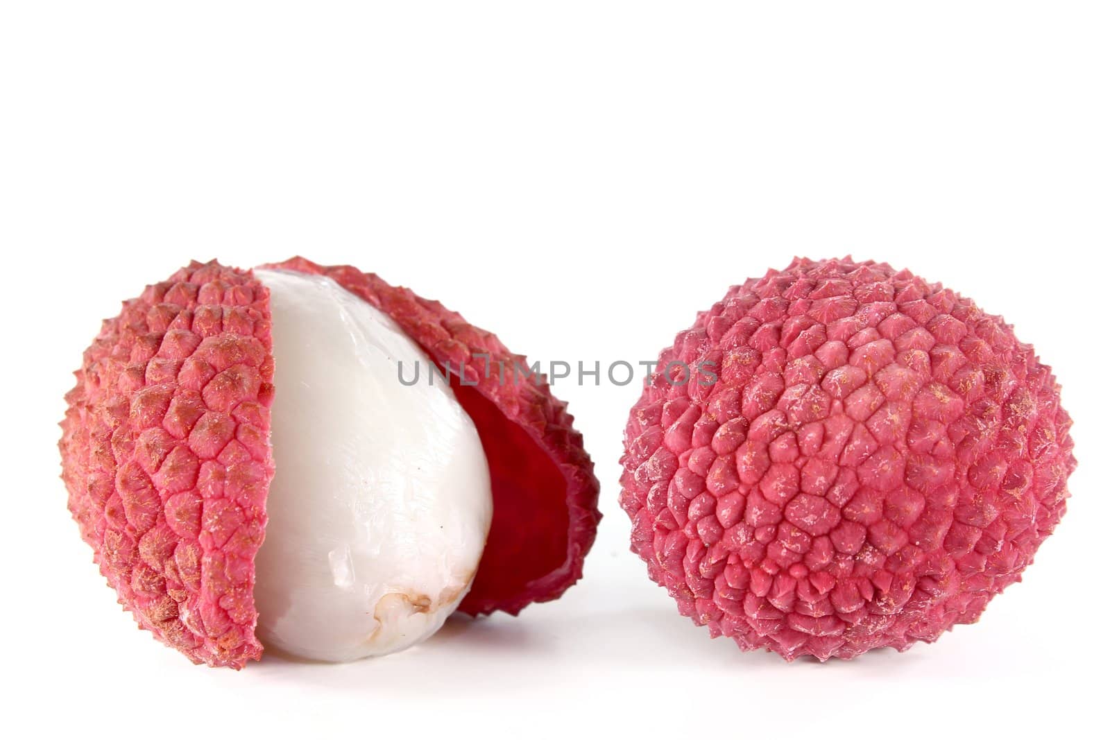 fresh red lychees on a white background