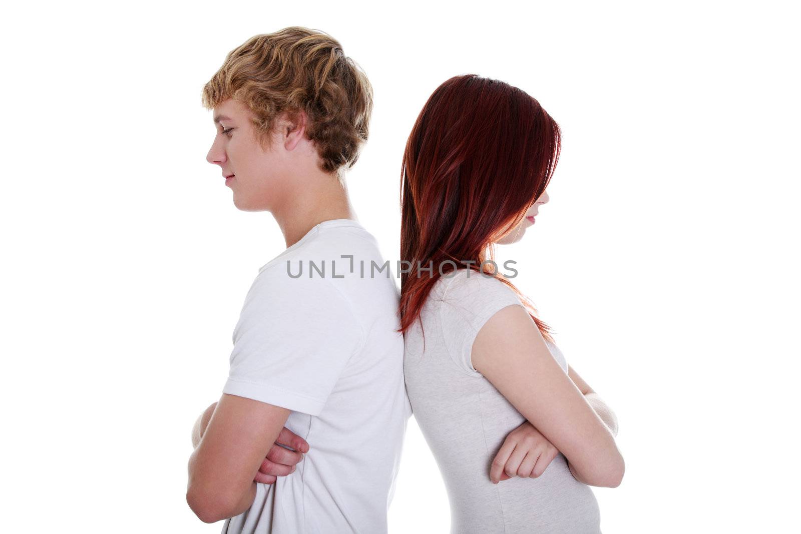 Angry couple standing back to back. Isolated on white background.