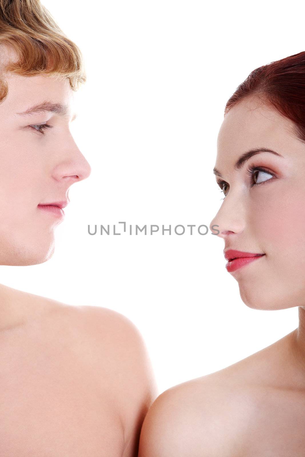 Young naked couple looking at each other. by BDS