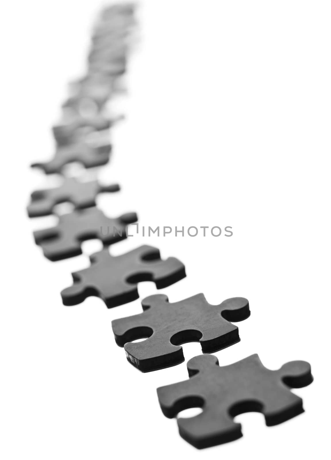 Black Jigsaw pieces in a row isolated on white