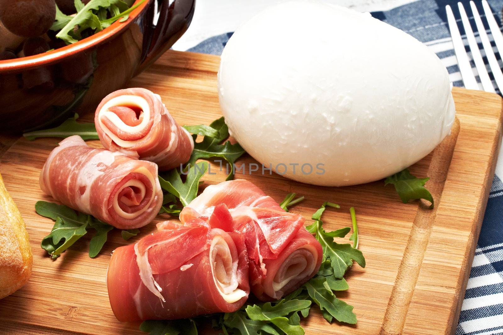 italian raw ham rolled with cheese and mozzarella.