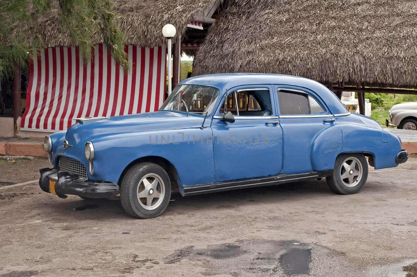 Vintage car shows signs of aging near Havana, Cuba.