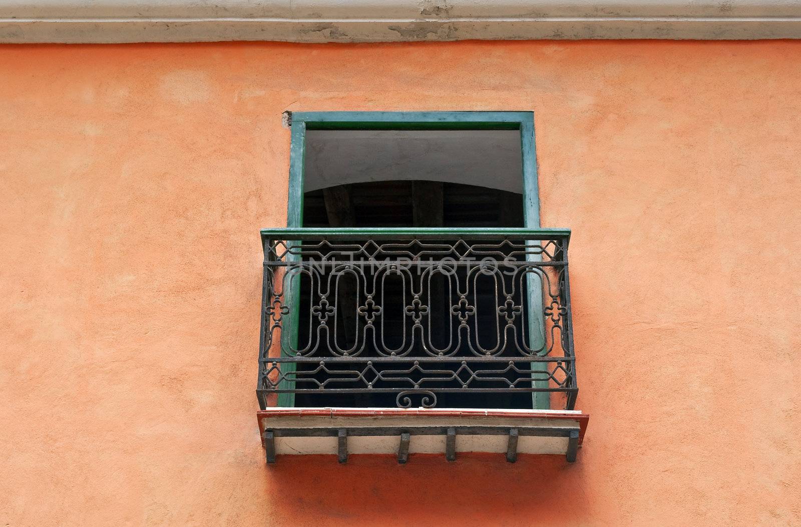 Detail of balcony in colorful poor house facade, Havana, Cuba.