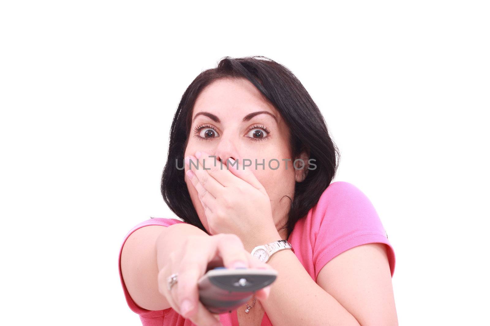 Scared young woman while watching TV in a white background