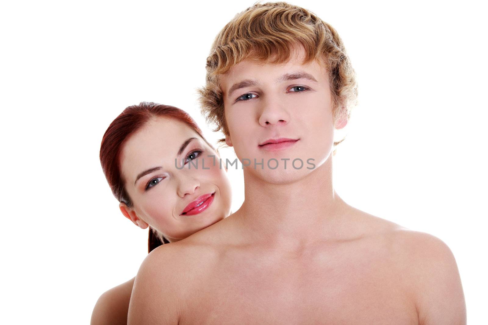 Topless couple standing against white background.