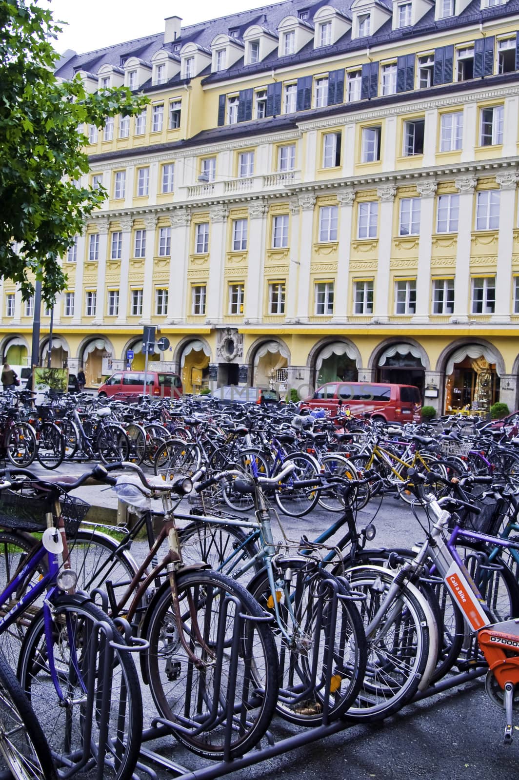 Many Bicycles parked in front of a building in Munich, Germany