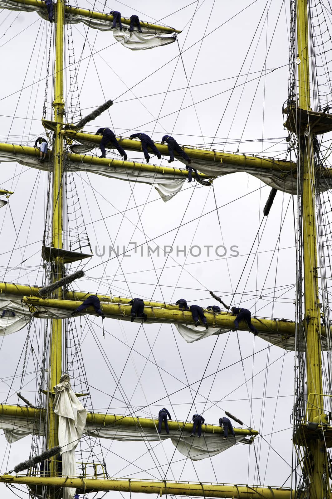 Many sailors hoisting sails at an international tall ship festival in Korea