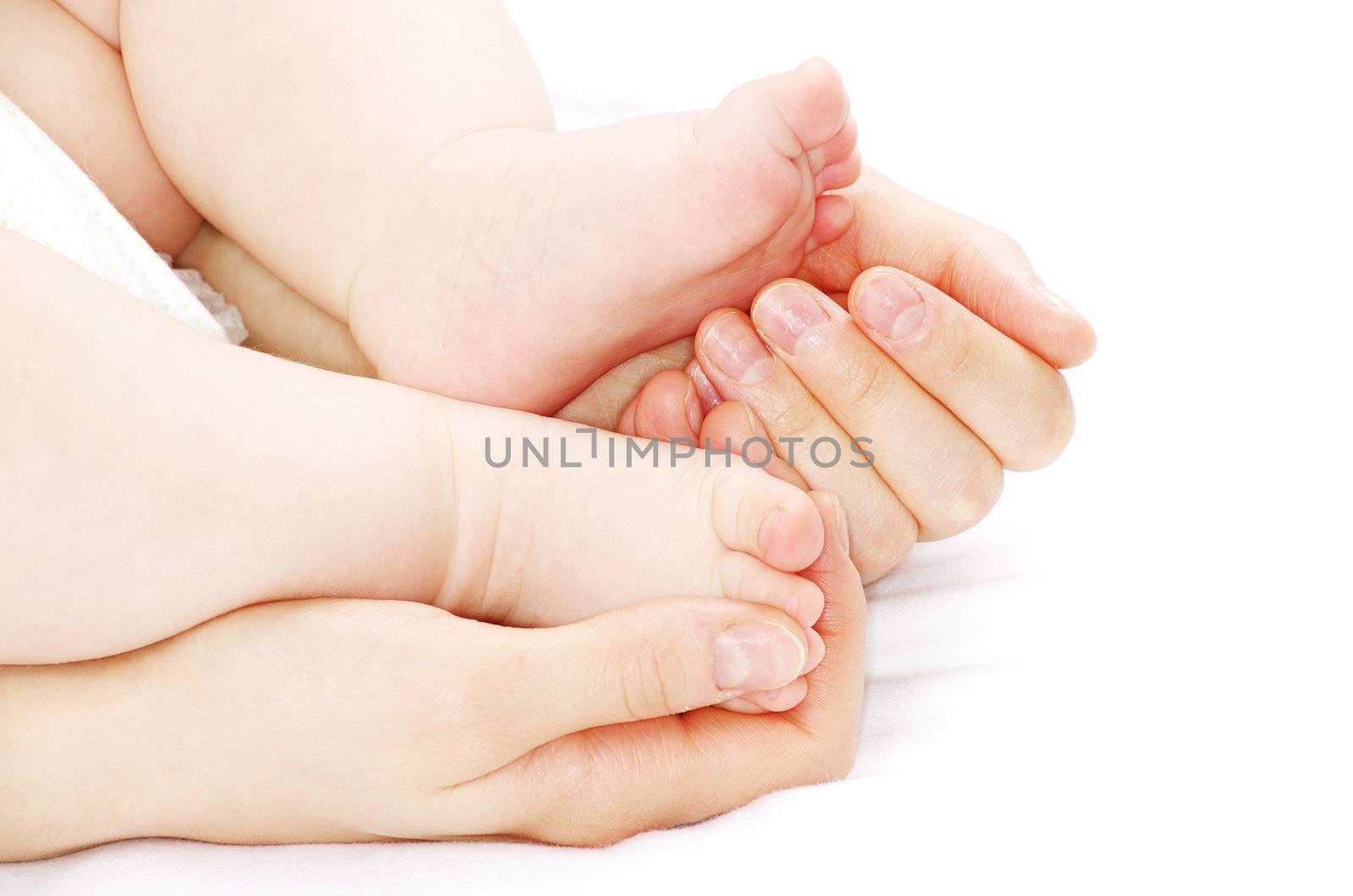 newborn baby feet isolated on white