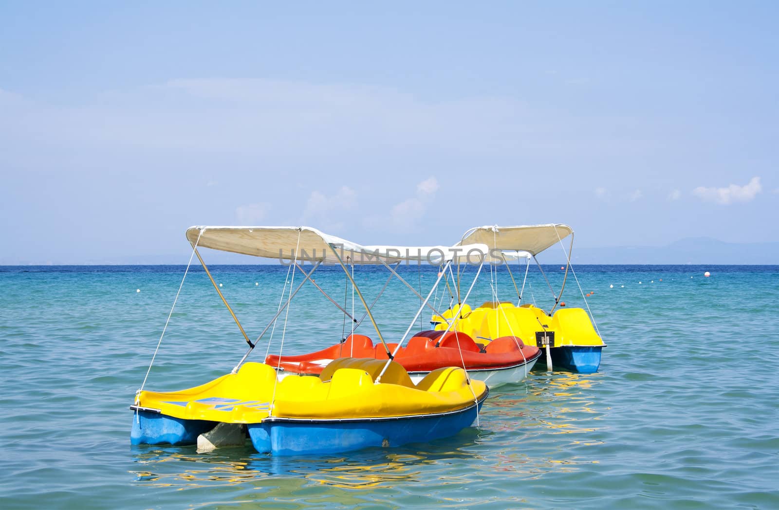 Pedal boats anchored in Aegean sea