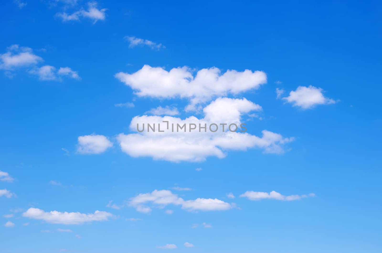 blue sky background with tiny clouds