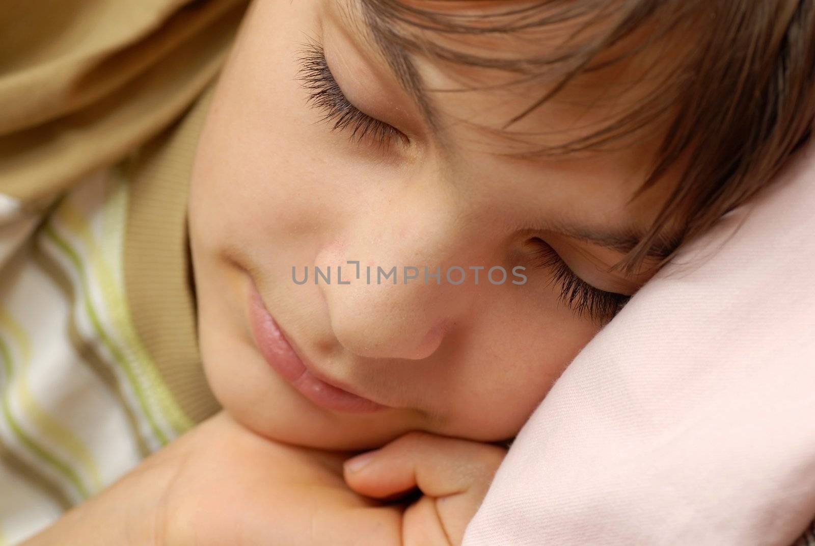 caucasian boy portrait, sleeping with arm under cheek