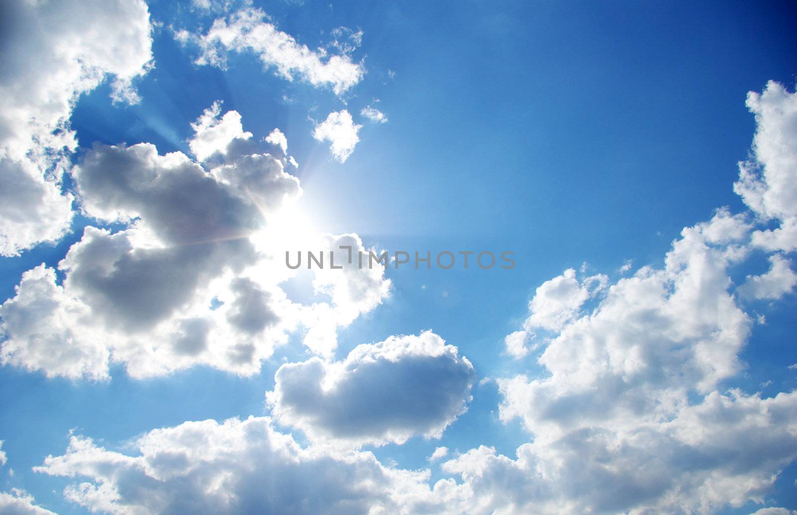 blue sky with clouds and sun