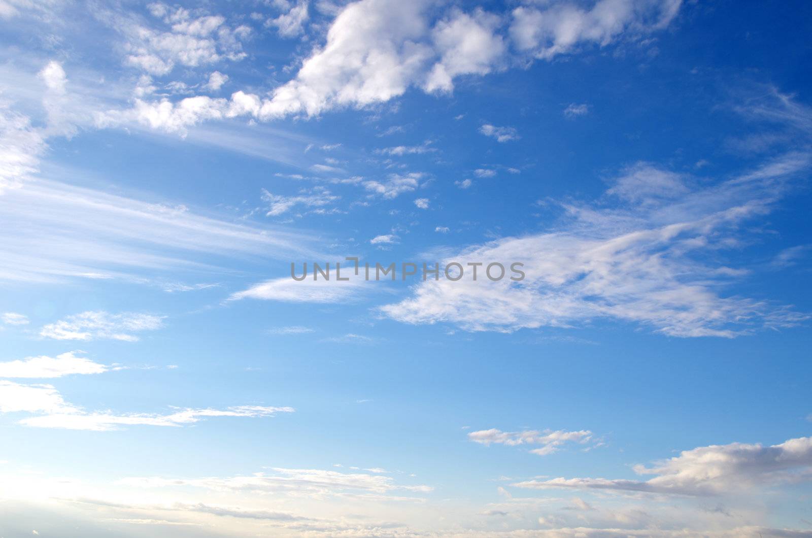 blue sky background with tiny clouds