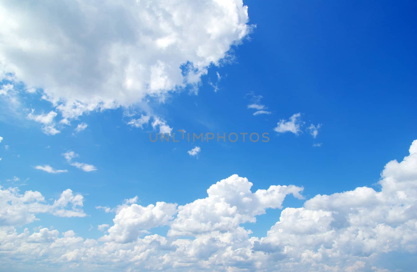 blue sky background with tiny clouds