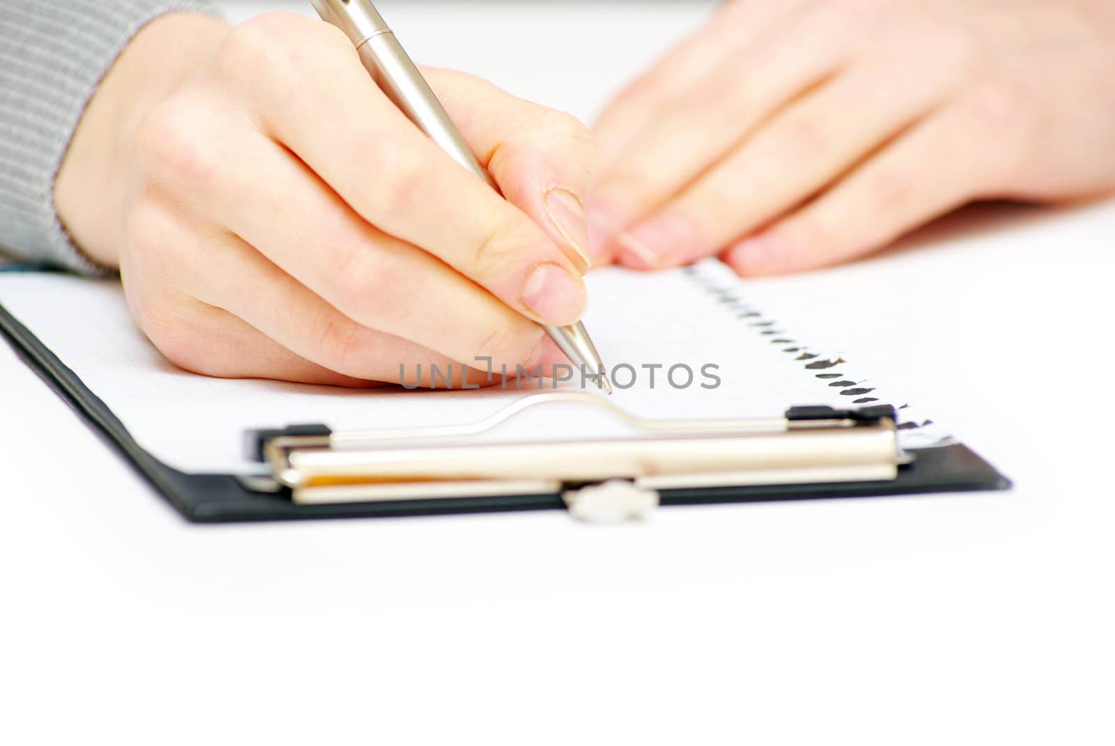 Hand and pen on the white background