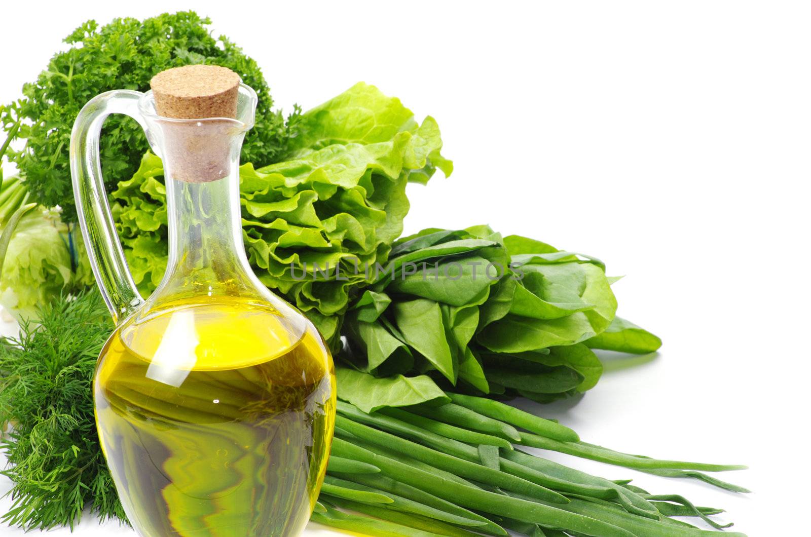 herbs and oil over white