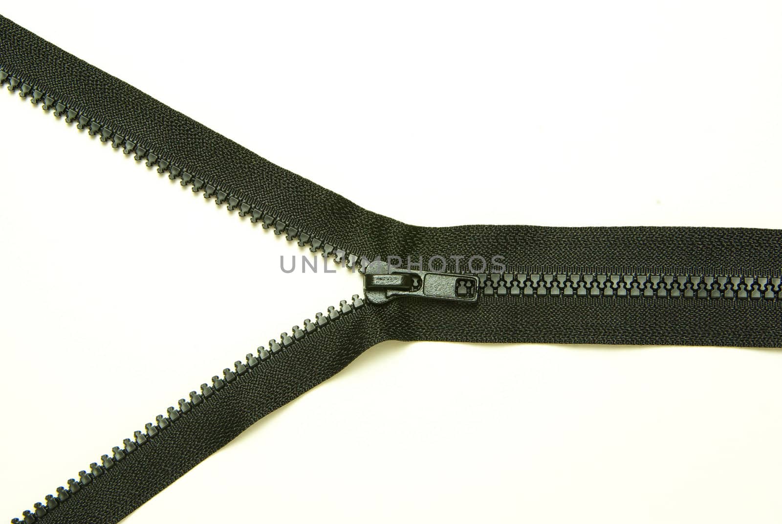 Unzipped  metal zipper on white background