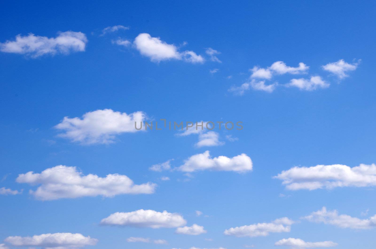 blue sky background with tiny clouds