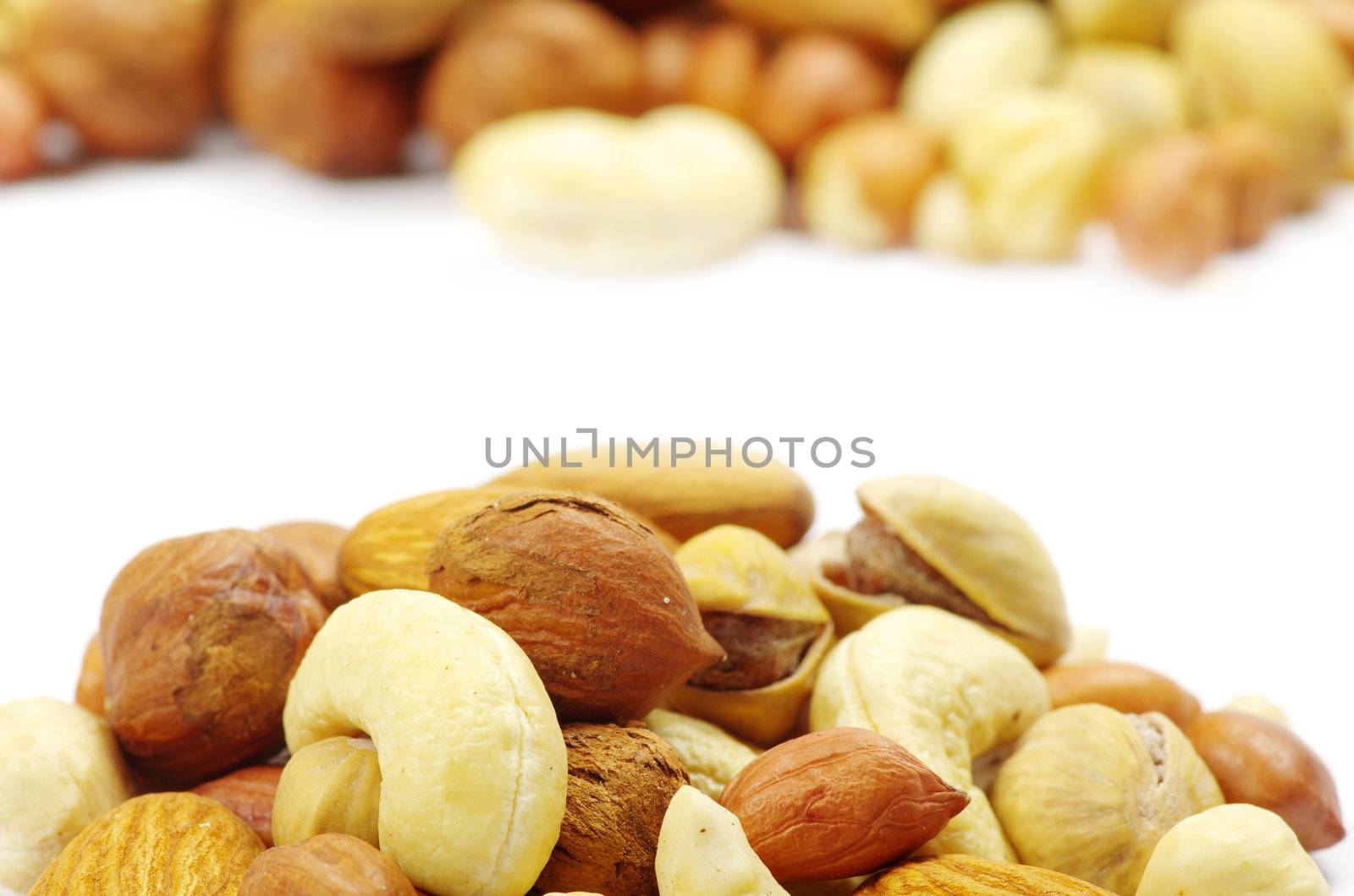 Assorted mixed nuts on white background