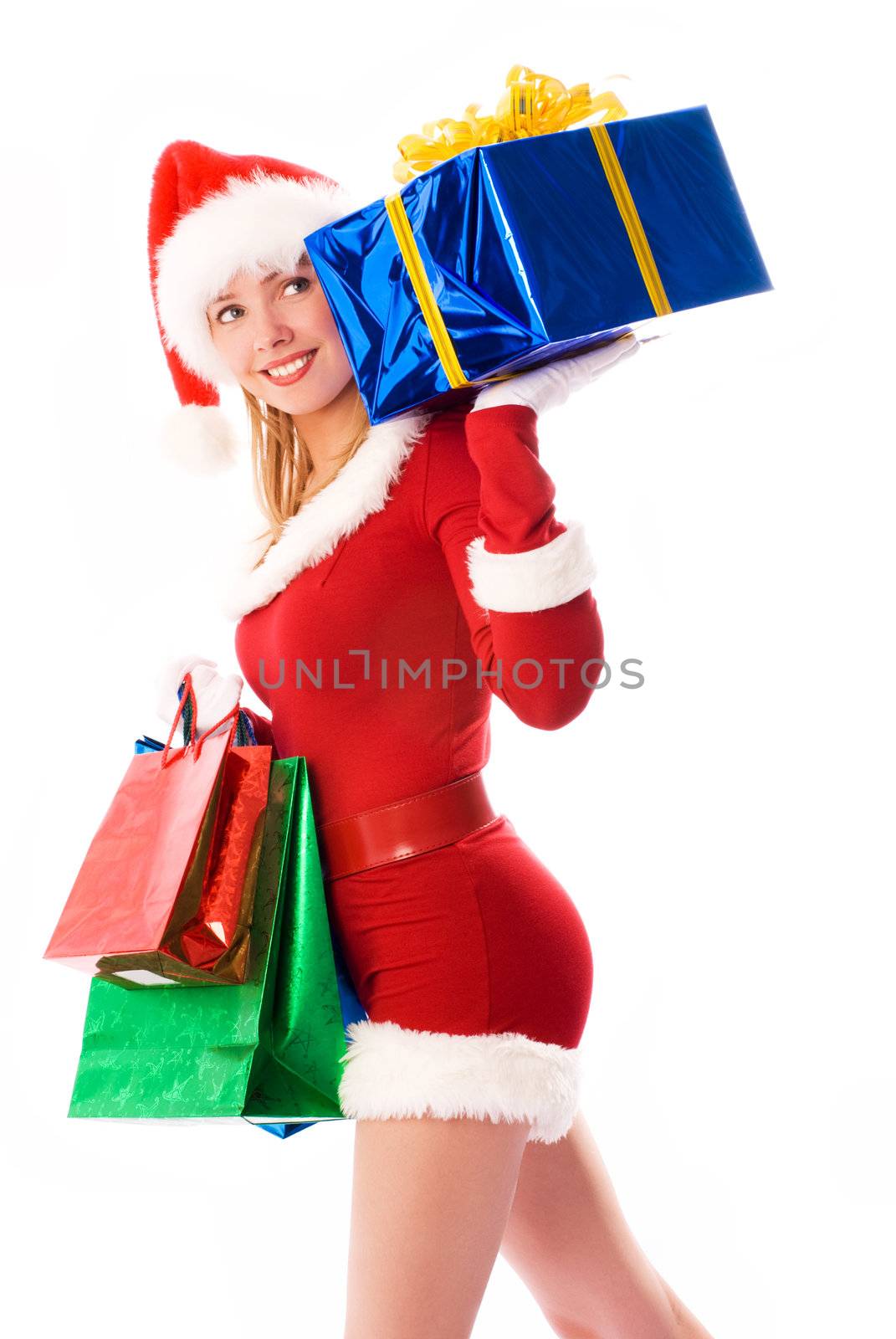pretty girl dressed as Santa with Christmas presents
