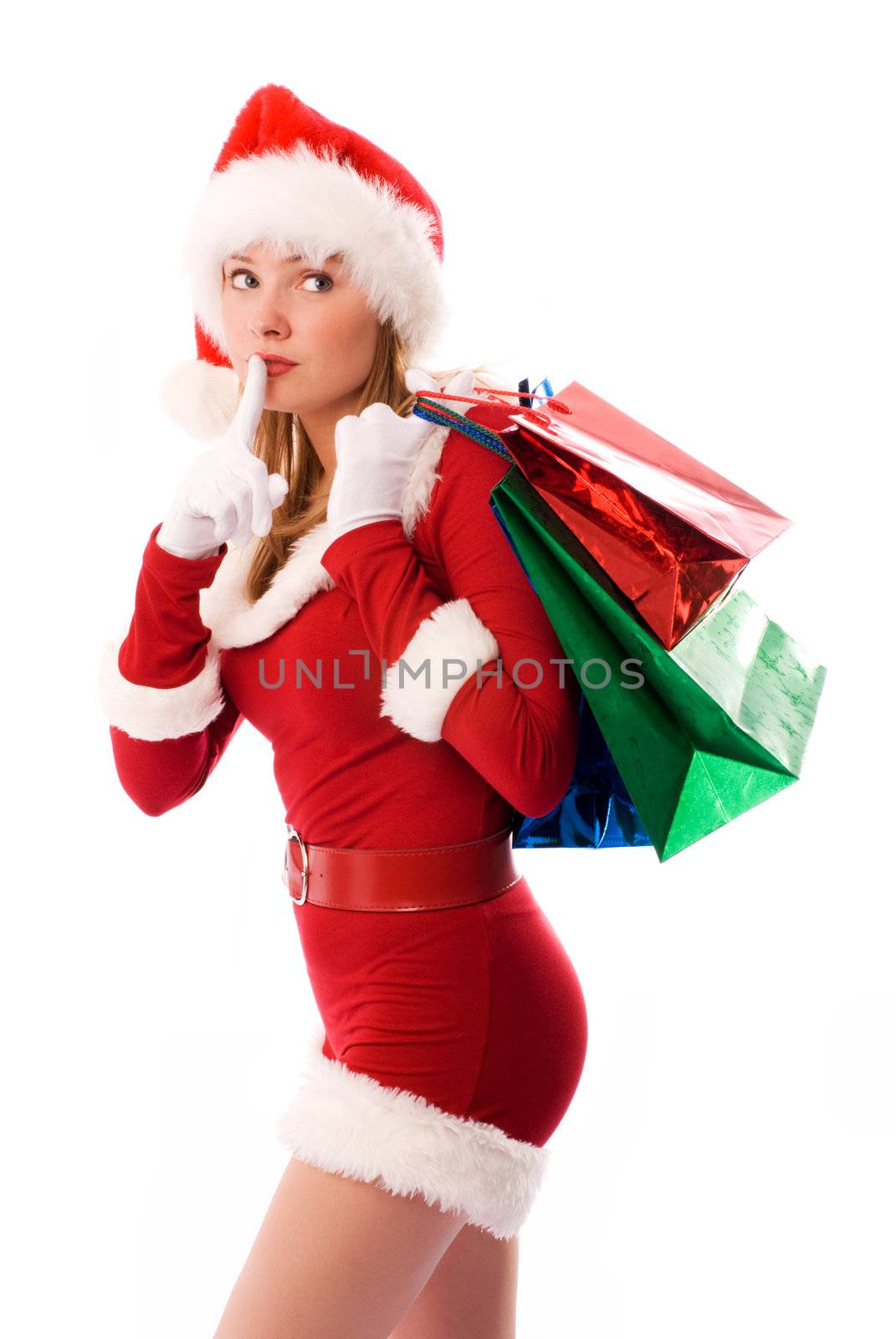beautiful girl dressed like Santa with Christmas presents