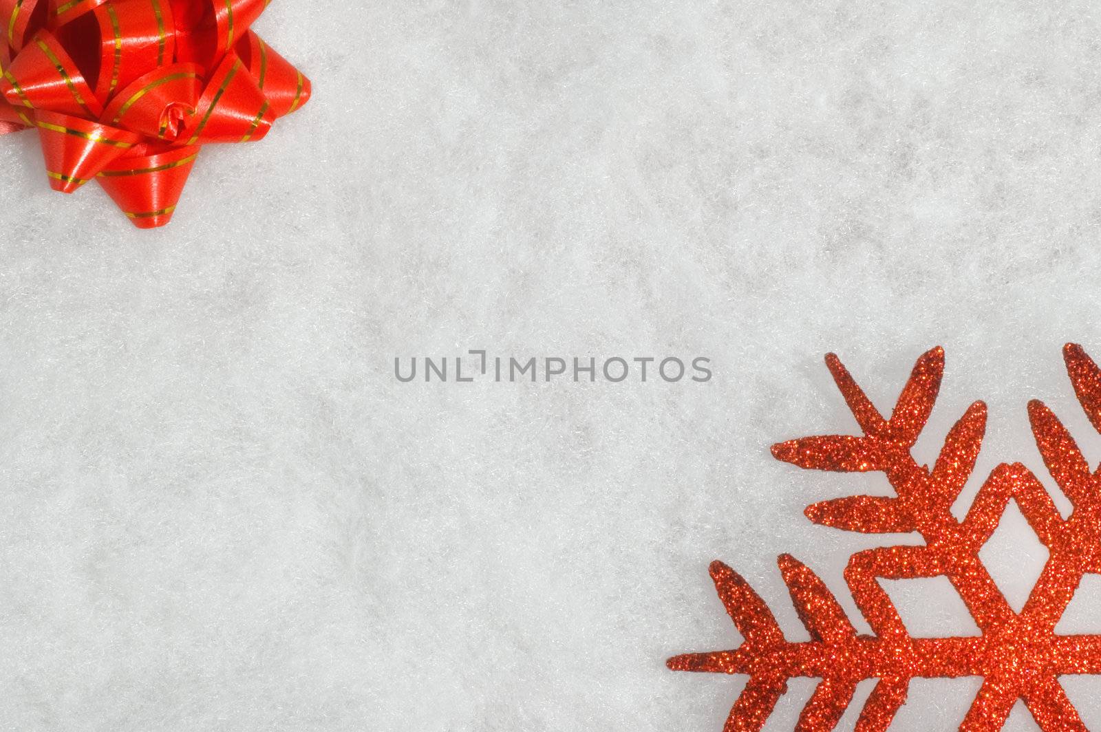 Christmas background with red ribbon and snowflake on fluffy white background. Copy space.