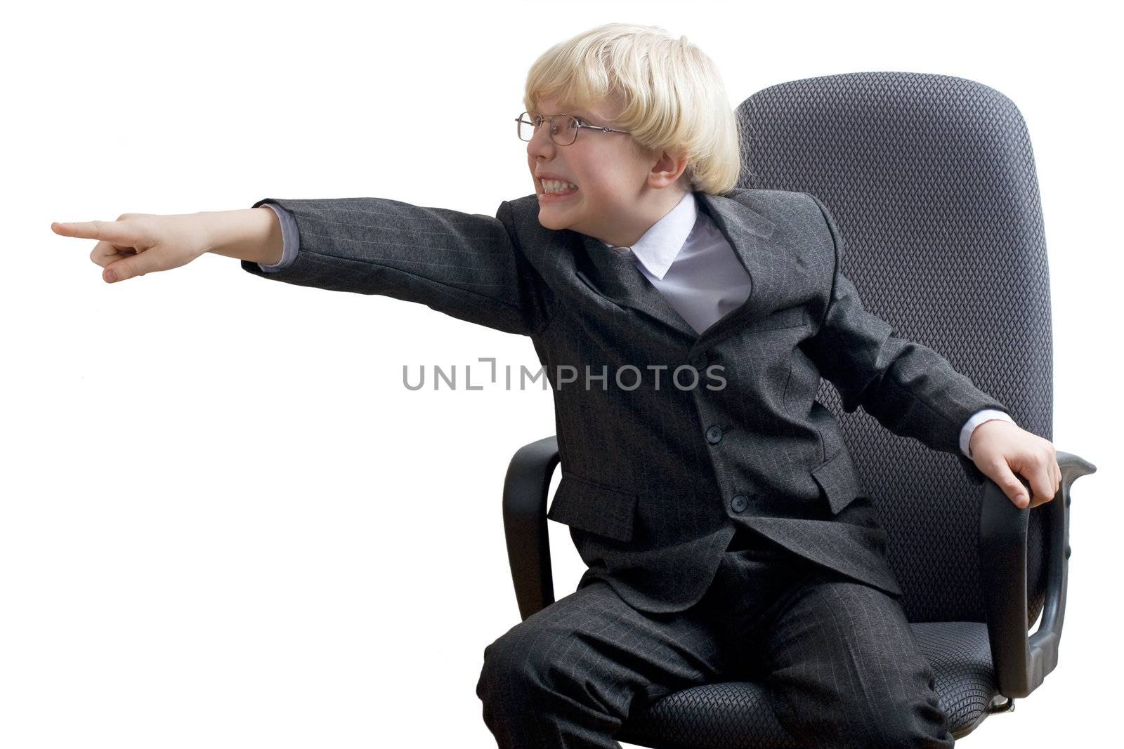 Angry boy transported with rage pointing with index finger. Isolated on white