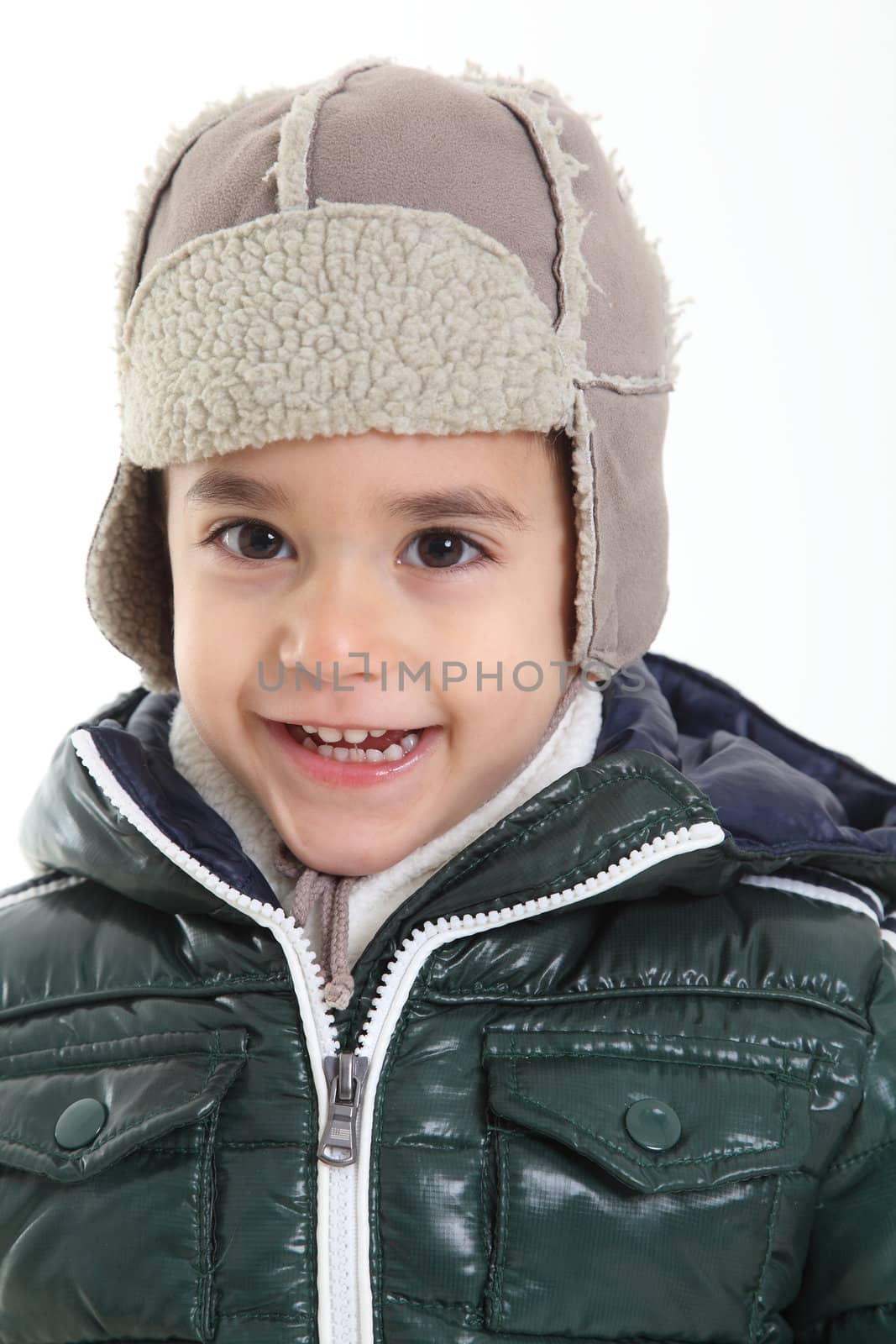 Child in winter clothes on white background