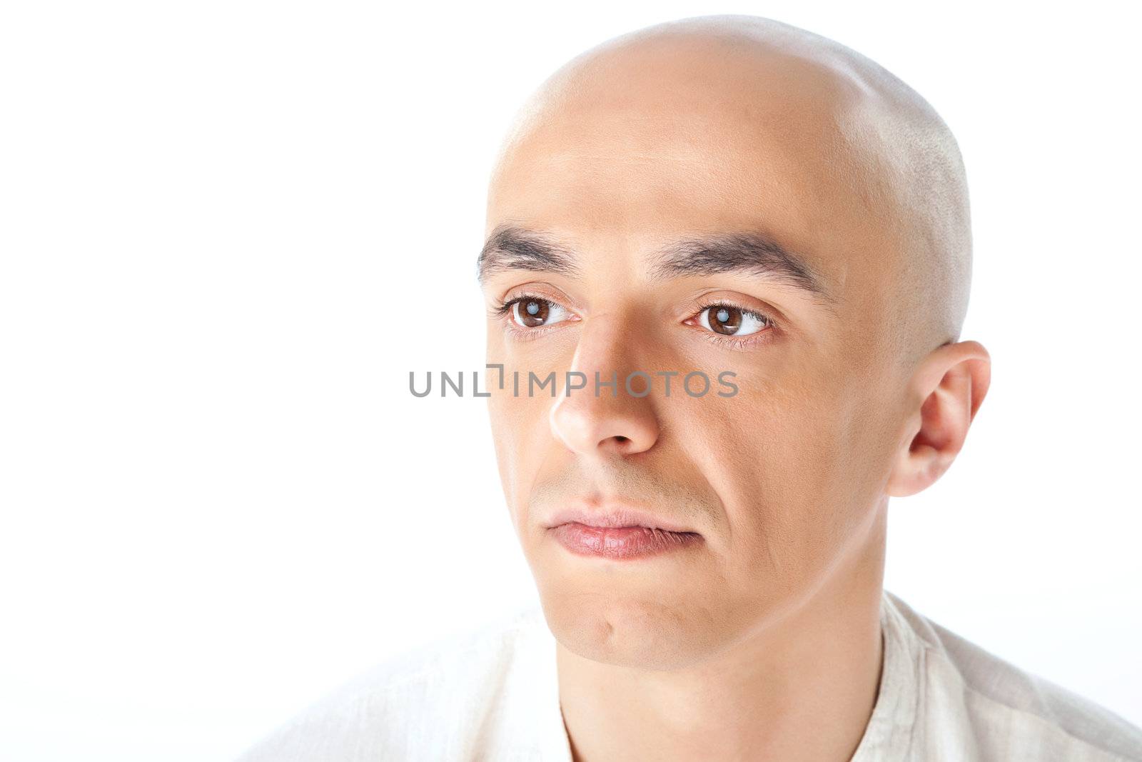 Close-up of a bald man's face isolated on white background