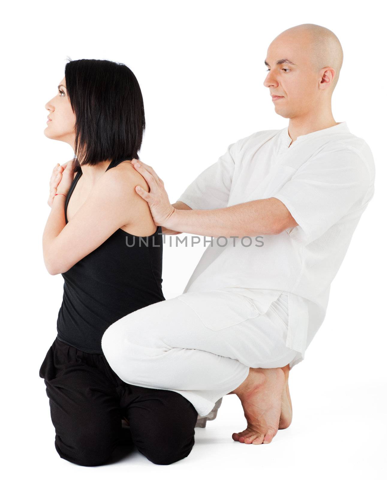 Therapist giving traditional thai massage on woman's back, isolated on white