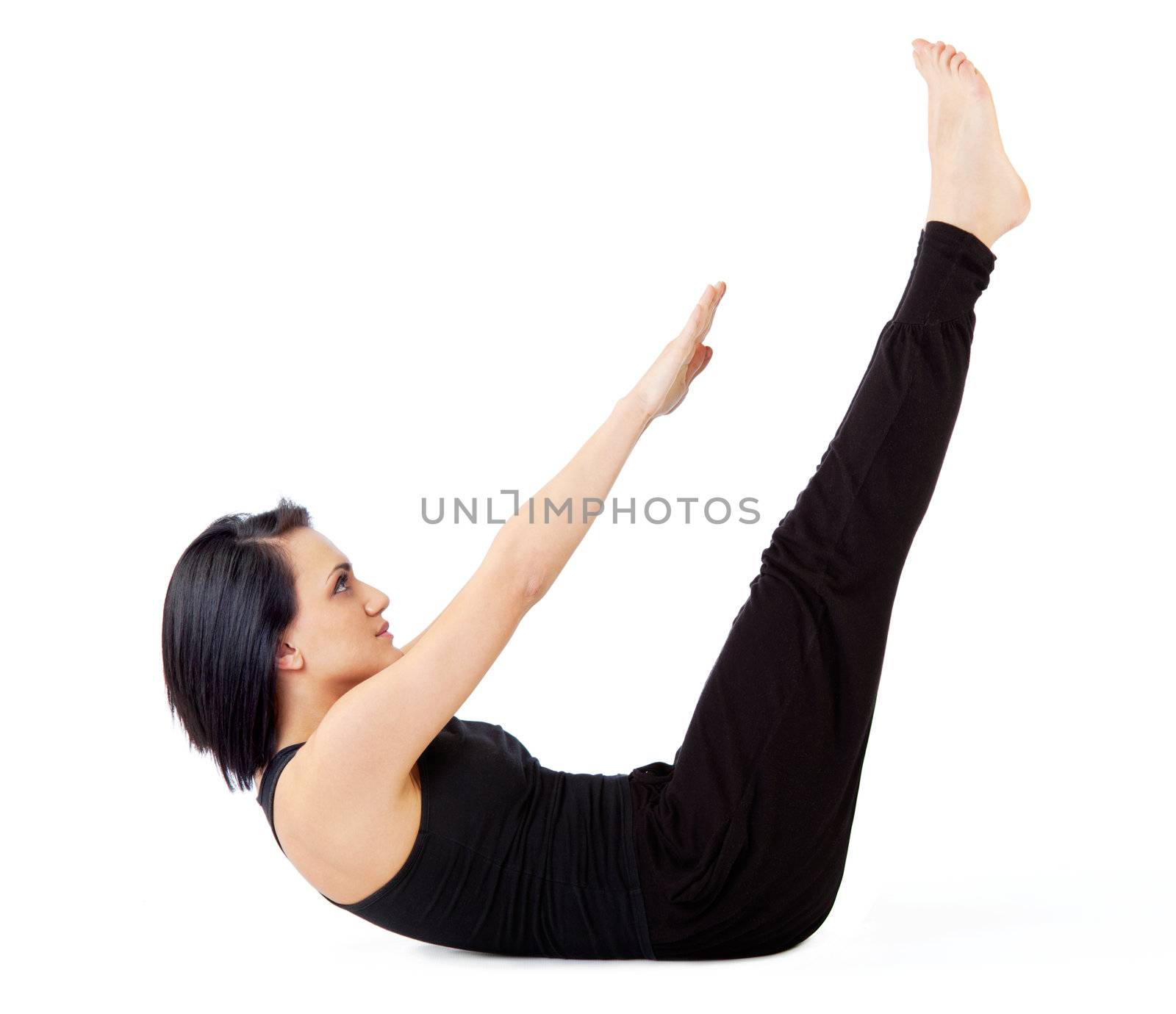 Young female doing sit-ups with arms and legs lifted, isolated on white